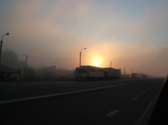 Trucks, smog, dust and the sunset on the road to Irkutsk